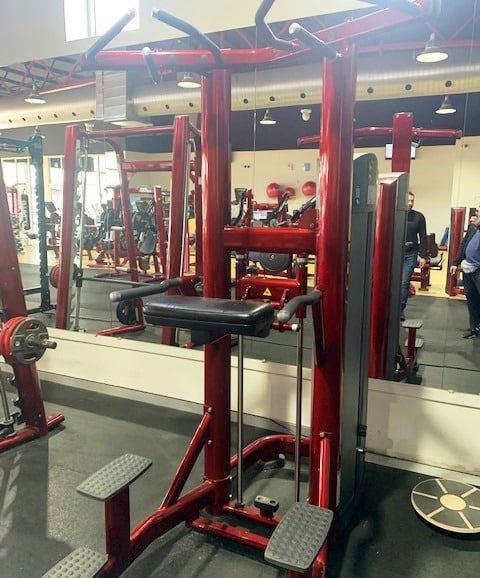 used life fitness assisted pull up and dip machine in a gym fitout