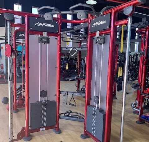 second hand compact cable cross trainers installed in a gym fitout
