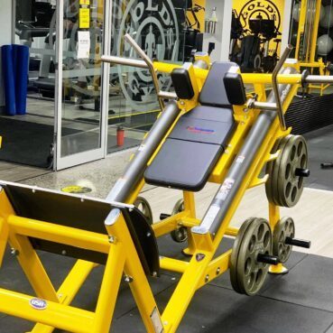 plate loaded tuff stuff hack squat machine in golds gym