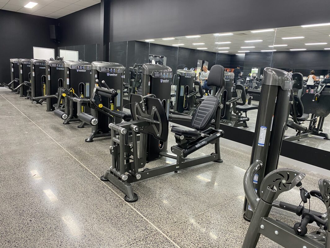 row of TuffStuff Bio-Arc commercial gym equipment