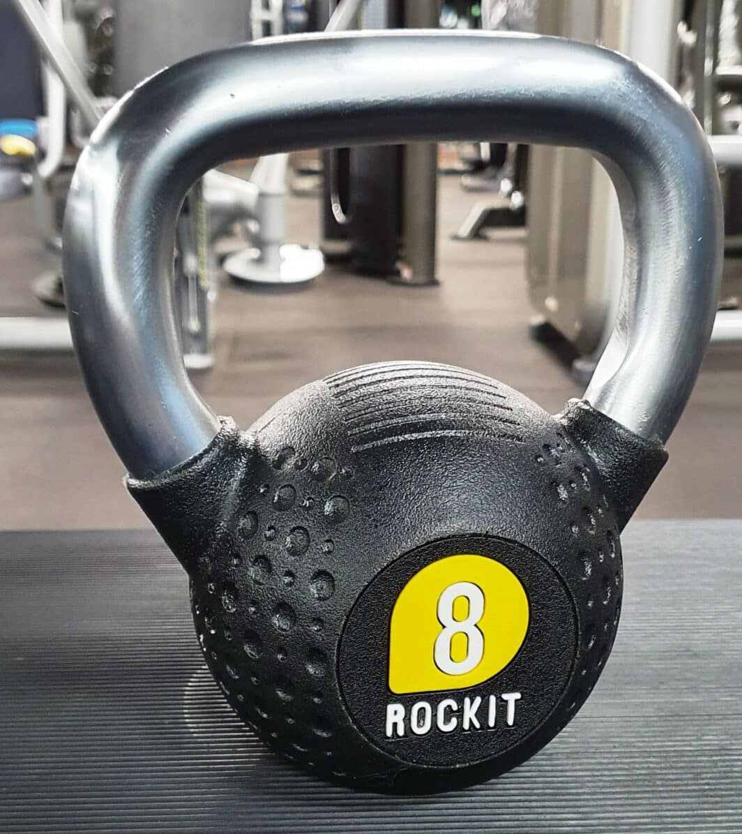 Rockit Urethane Kettlebells with yellow decoration in gym setting