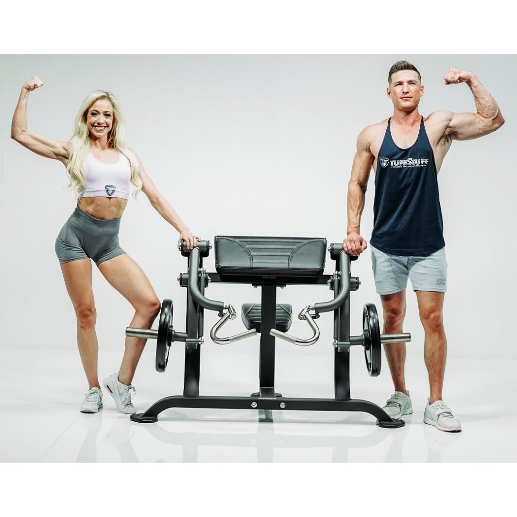 trainers posing next to the TuffStuff Proformance Plus Biceps Curl (PPL-920)