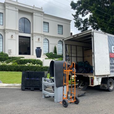 gym solution truck delivering and installing gym equipment in a home gym